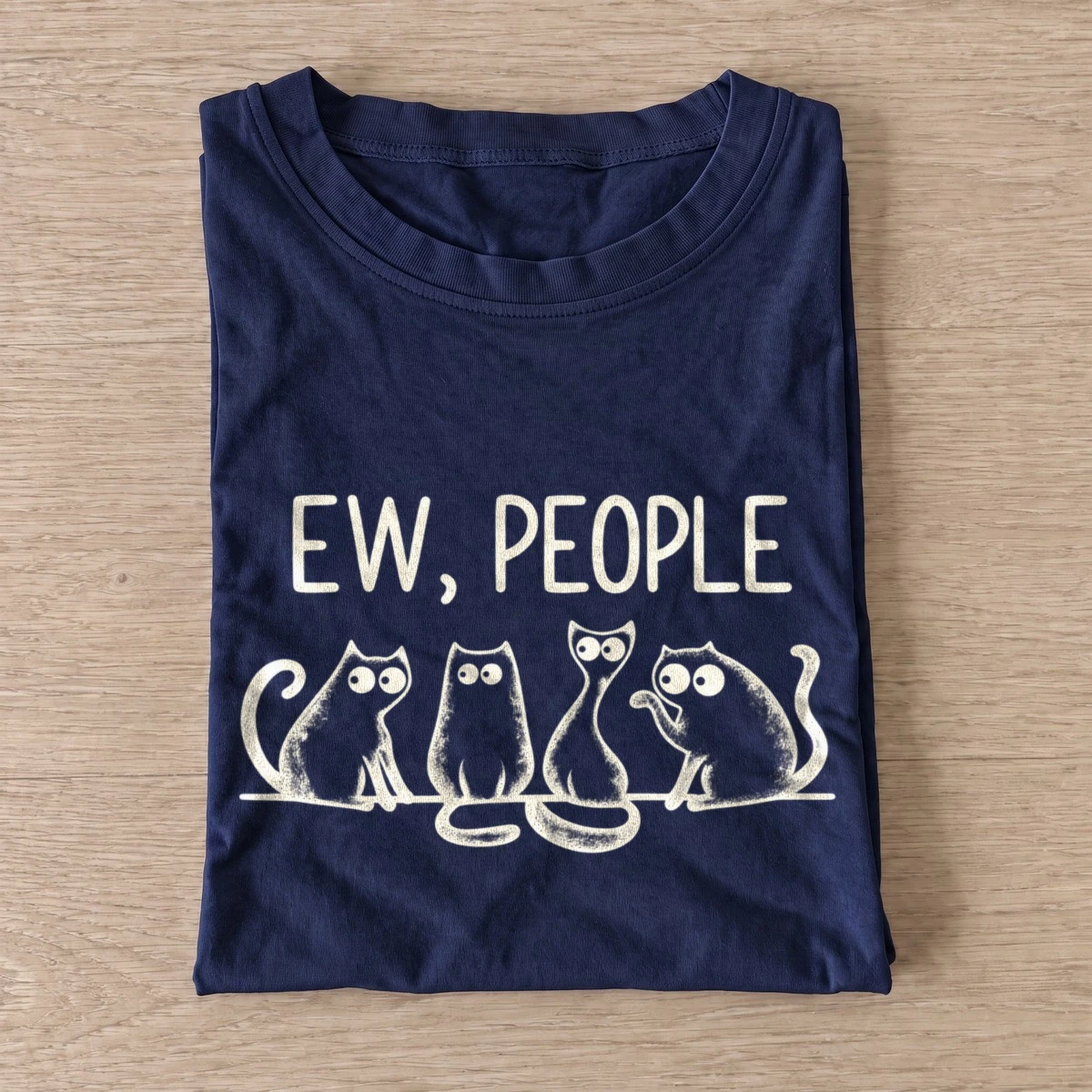 Navy Ew People Cat Squad T-shirt with three wide-eyed cats beneath EW, PEOPLE lettering