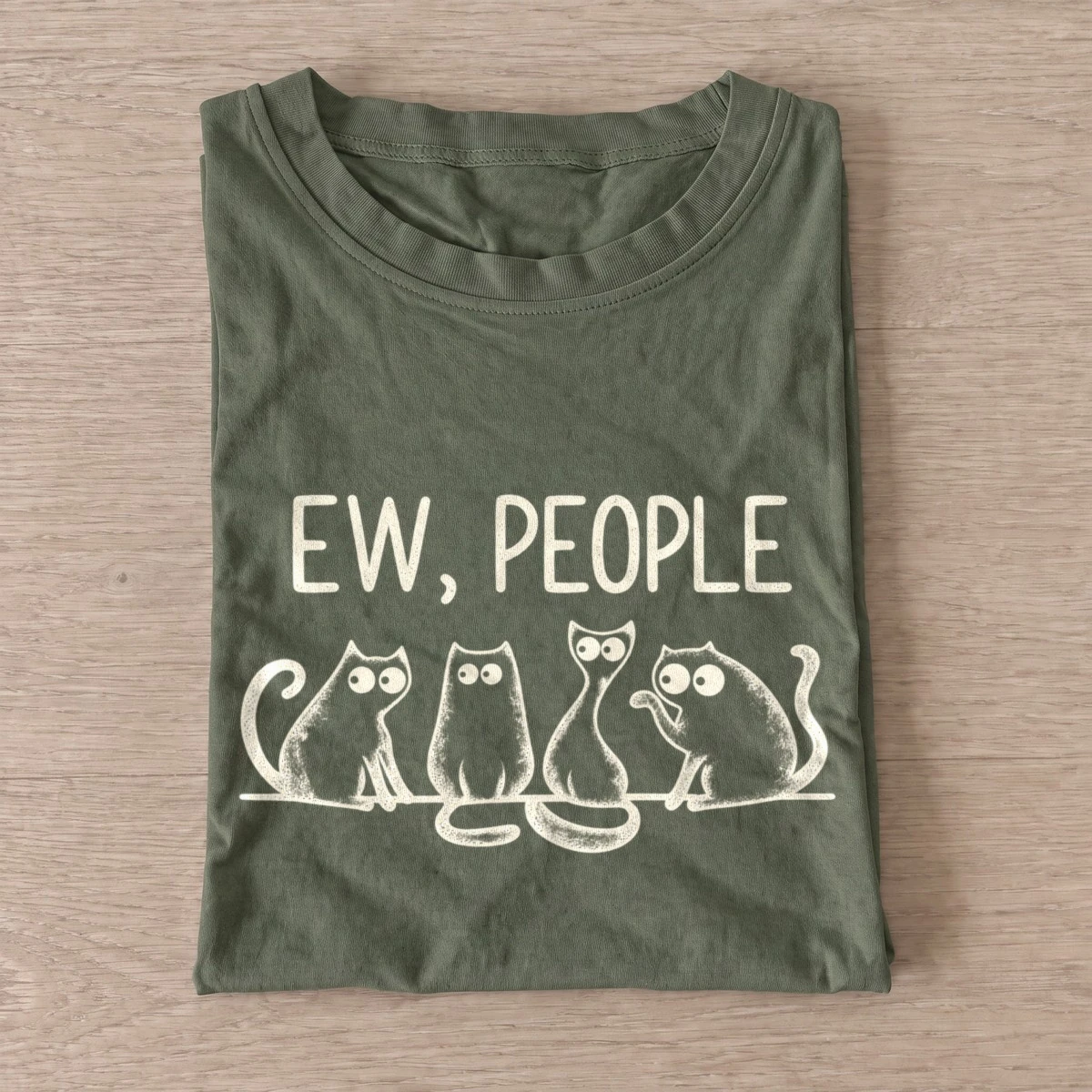Olive Ew People Cat Squad T-shirt with three wide-eyed cats beneath EW, PEOPLE lettering