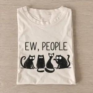 Sand Ew People Cat Squad T-shirt with three wide-eyed cats beneath EW, PEOPLE lettering