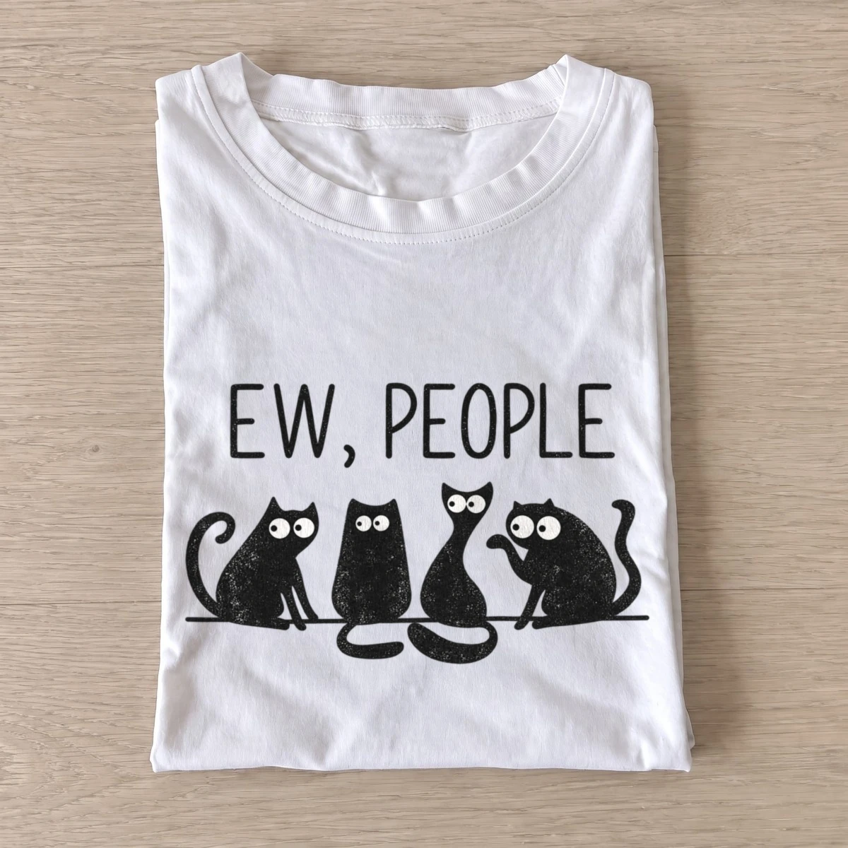 White Ew People Cat Squad T-shirt with three wide-eyed cats beneath EW, PEOPLE lettering