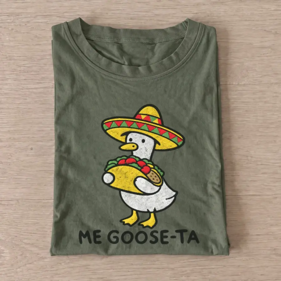 Olive Me Goose Ta Funny Taco Goose T-shirt with a sombrero-wearing goose holding a taco above ME GOOSE-TA lettering